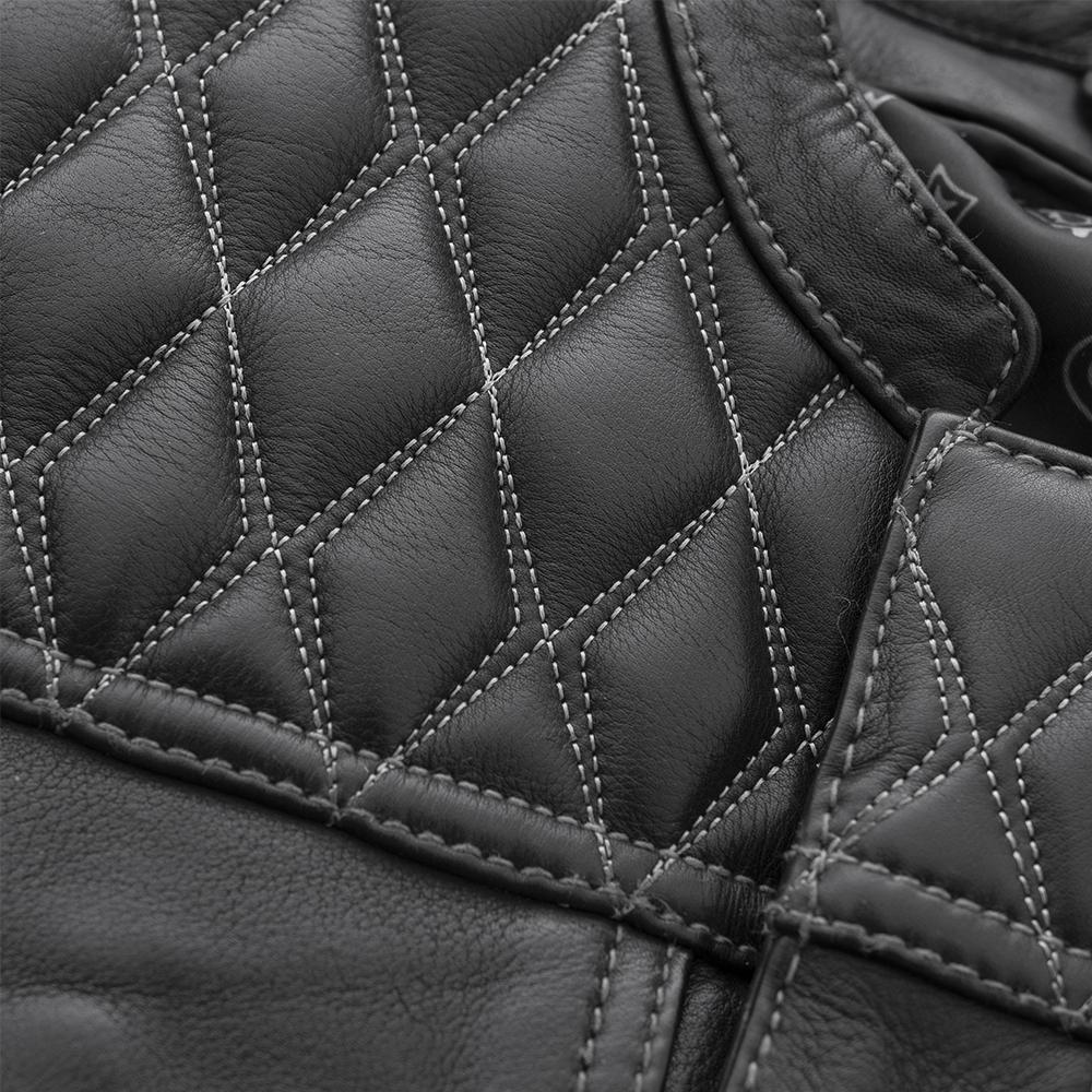 Close-up detail of the Cinder Leather Jacket’s diamond-quilted shoulder, highlighting intricate stitching and premium leather