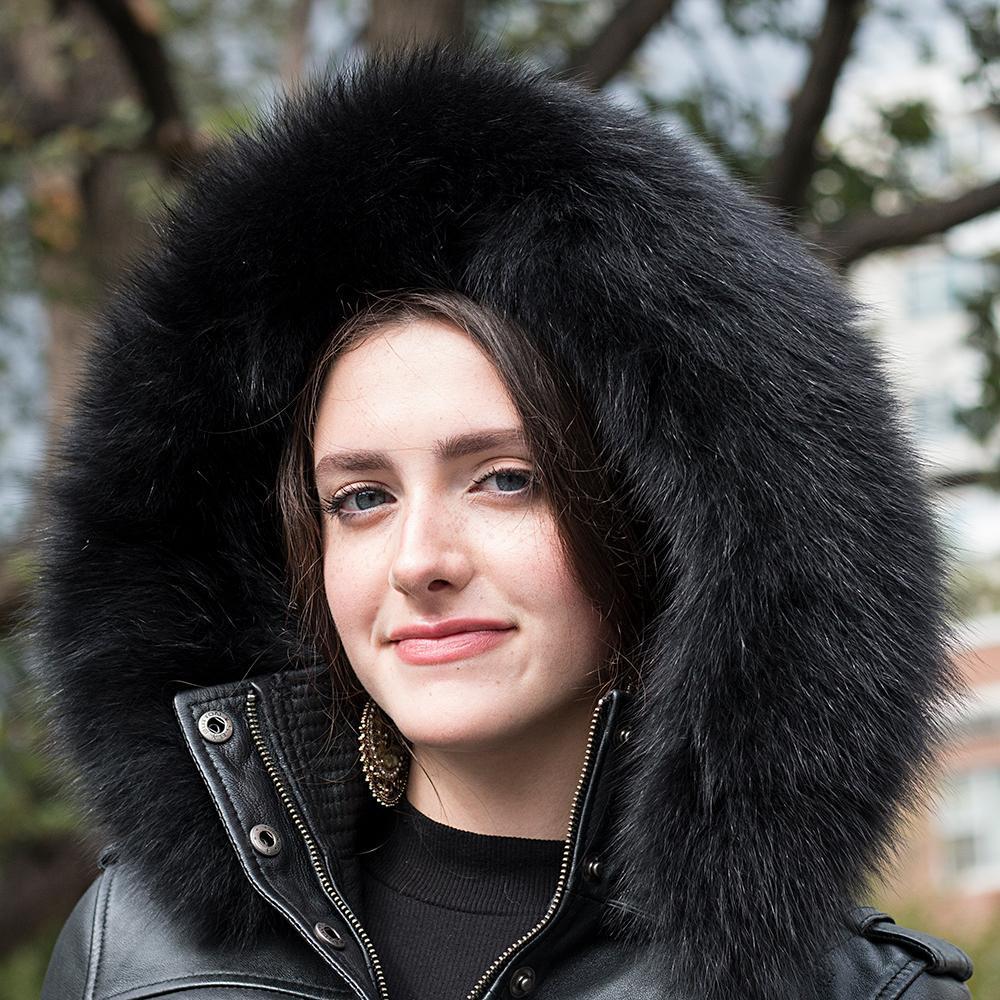 Close-up of a model in the Elle Leather Jacket, highlighting premium sheepskin leather, intricate quilting, and a plush fox fur collar