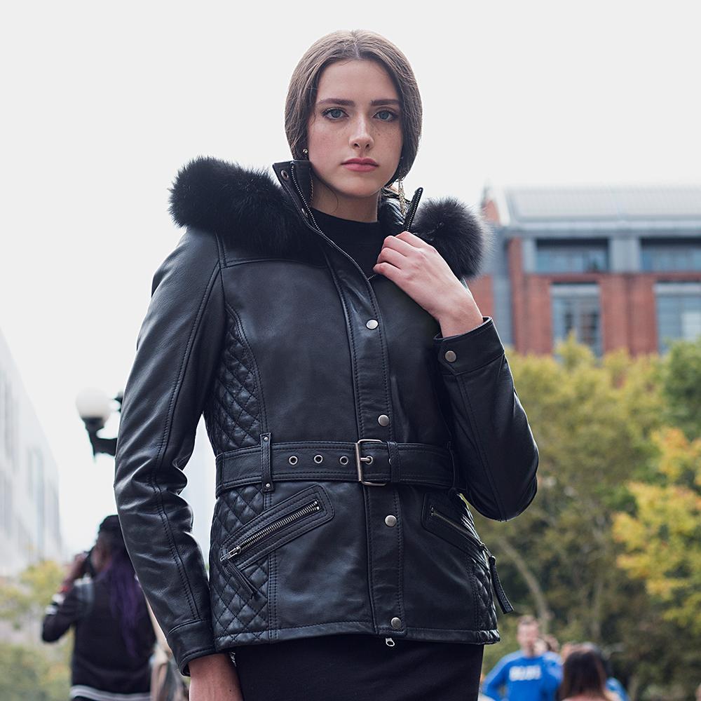 A model wearing the Elle Leather Jacket in black, demonstrating its balance of elegance, comfort, and removable fox fur collar