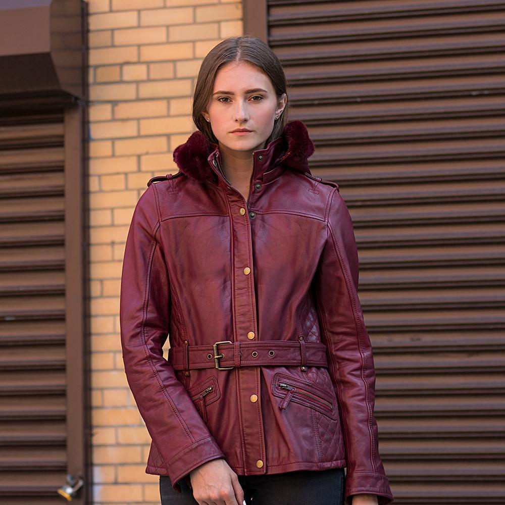 A model wearing the Elle Leather Jacket in oxblood, demonstrating its balance of elegance, comfort, and removable fox fur collar