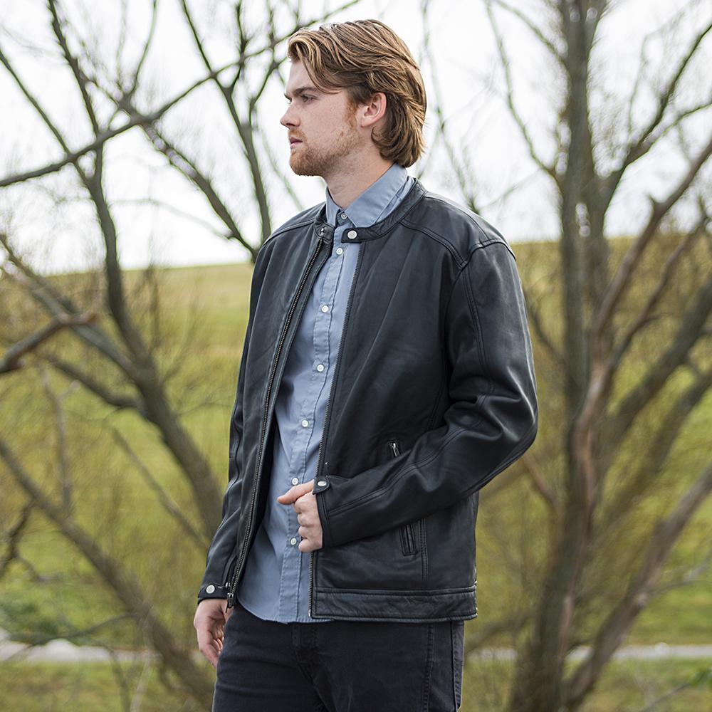 A model wearing the Iconoclast Leather Jacket in black, demonstrating its effortless comfort and understated boldness