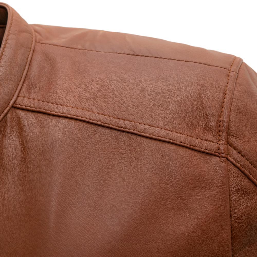 Close-up detail of the Iconoclast Leather Jacket in whiskey, showing quality stitching and premium sheepskin texture